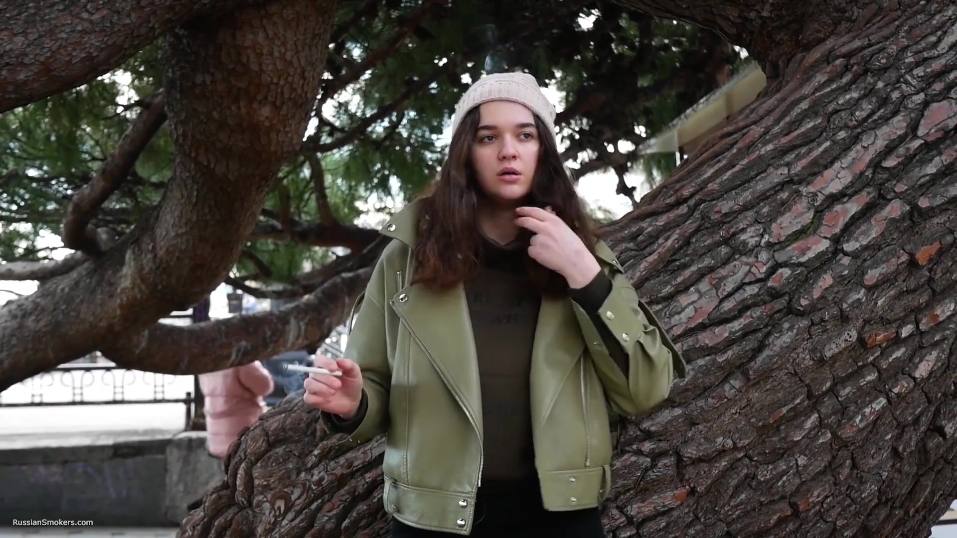 Young Brunette Is Taking An Unhurried Stroll With Allwhite 120mm Cigarette