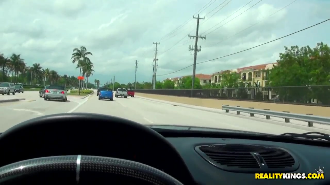 Caprice sucks on a dong while driving