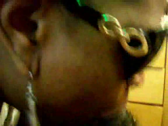 Black slut with sunglasses takes cock deep in her mouth