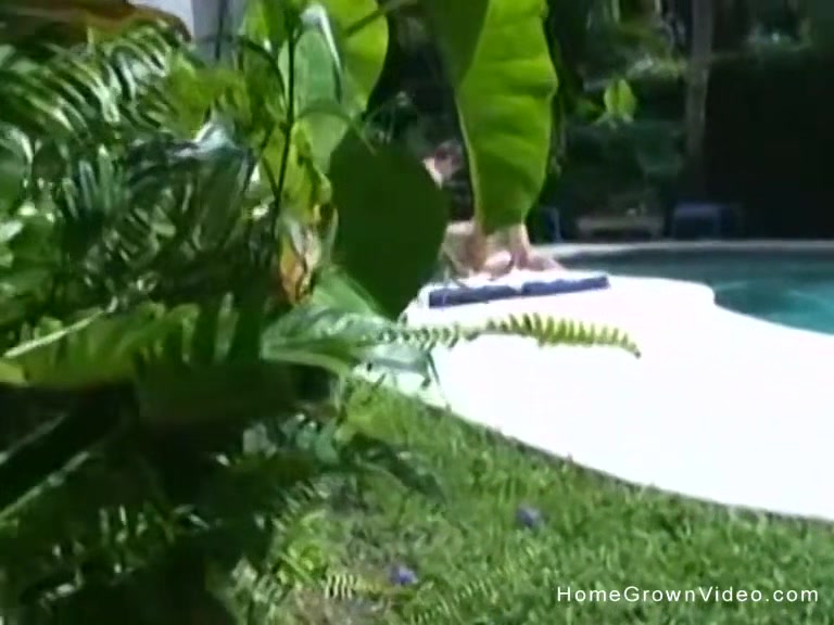 Big tit girlfriend giving a handjob outside by the pool