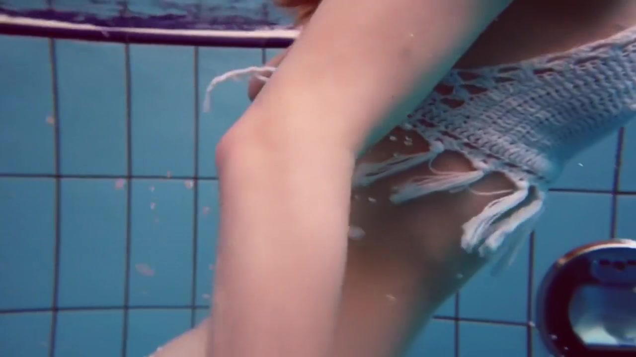 Dianas Redhead Beauty Enhances Her Swimming Grace