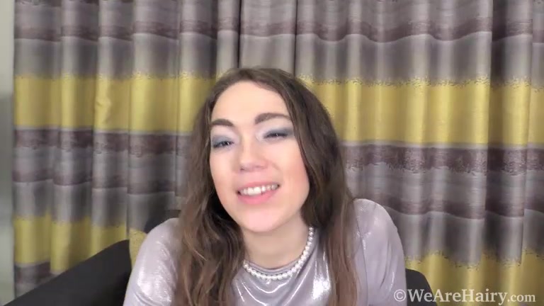 Lilu strips naked on her black armchair - WeAreHairy
