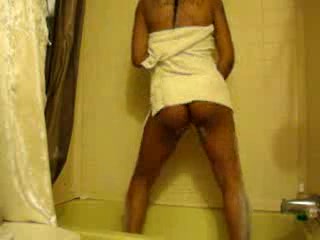 Young Ebony soaps her crotch and bum before dancing naked