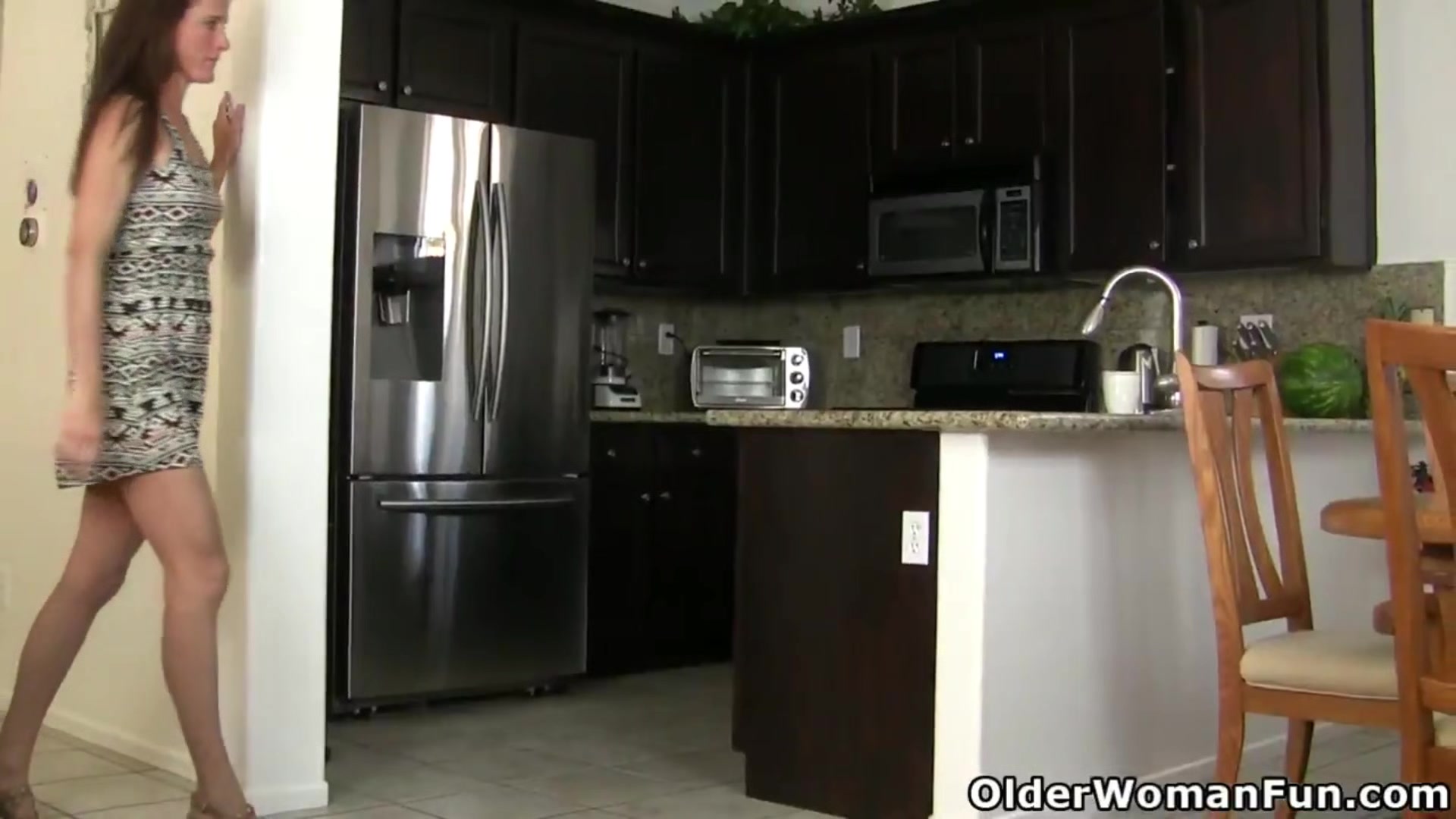 American milf Lacy gets naughty in the kitchen