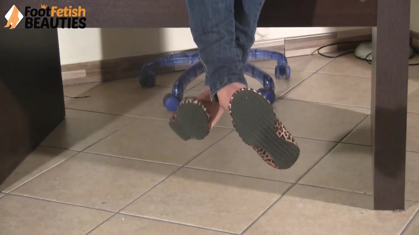 Gorgeous Valeria dangling her leopard-print ballet flats from her toes