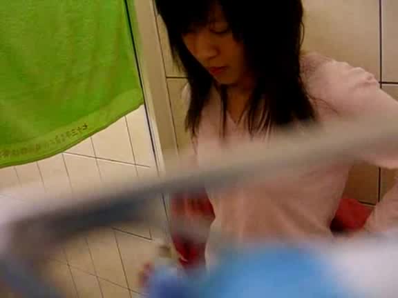 Young Asian babe caught naked in the bathroom by horny