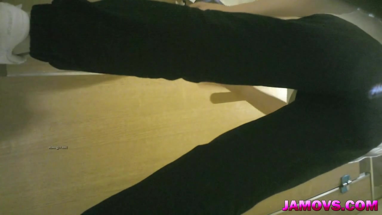 An Asian prostitute dressed in all black is caught on a