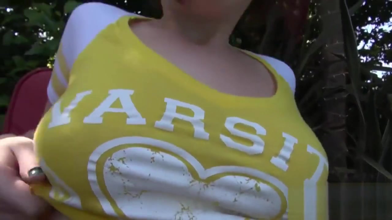 Busty young redhead rides a long dong