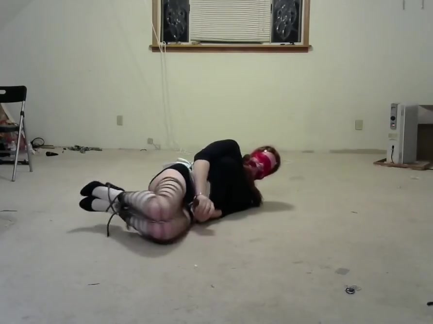 crossdresser in multiple bondage positions 3