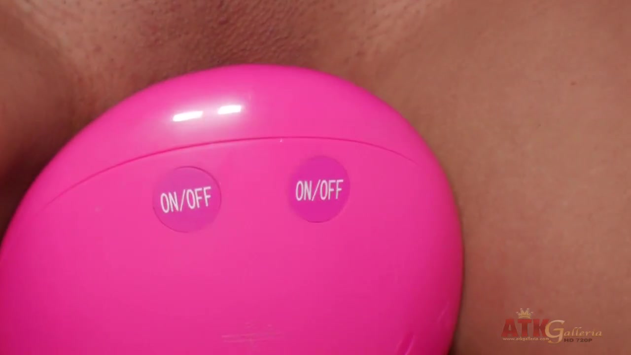Exotic brunette riding a toy