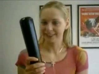 Cute blonde gal tries to shove a baseball bat in her pussy