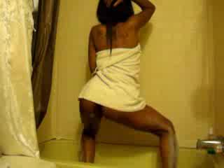 Young Ebony soaps her crotch and bum before dancing naked