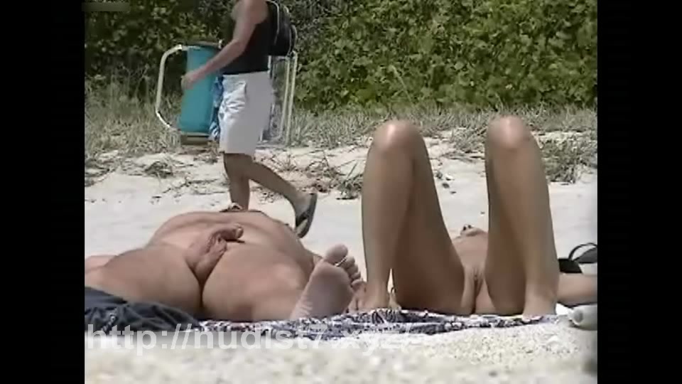 Beauty nudist putting sunscream on her mounds