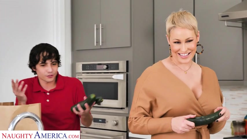 Ryan Keely makes the delivery boy a cock sandwich between her tits - naughtyamerica