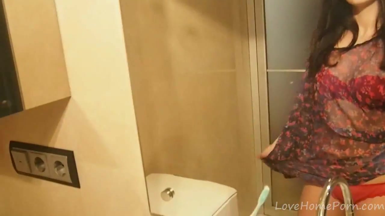Brunette gets naked and masturbates in the bathroom