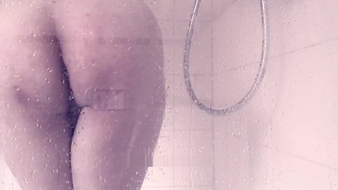 SIssy Tiffani masturbates in the shower