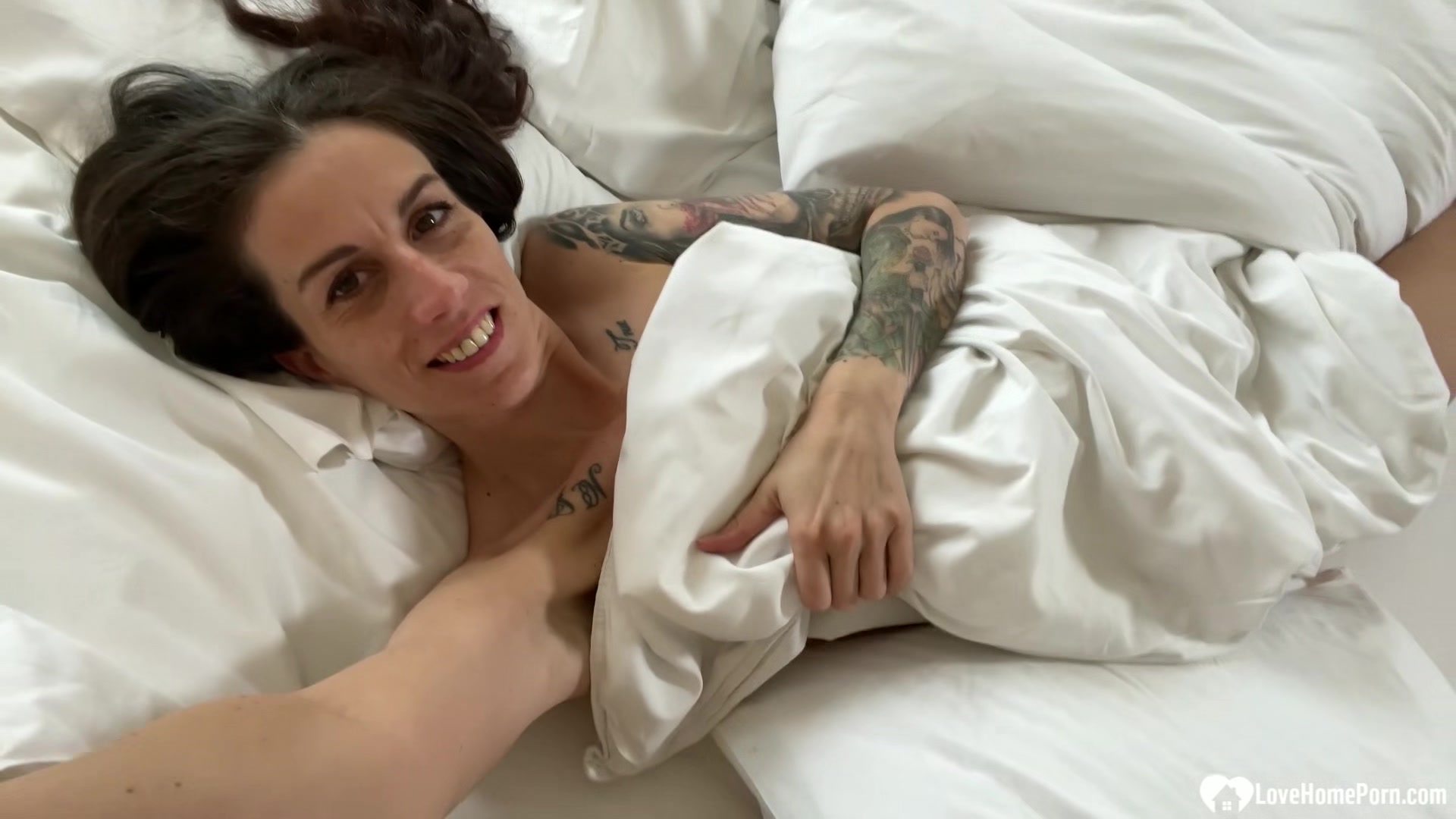 Cute tattooed girl playing with her slit