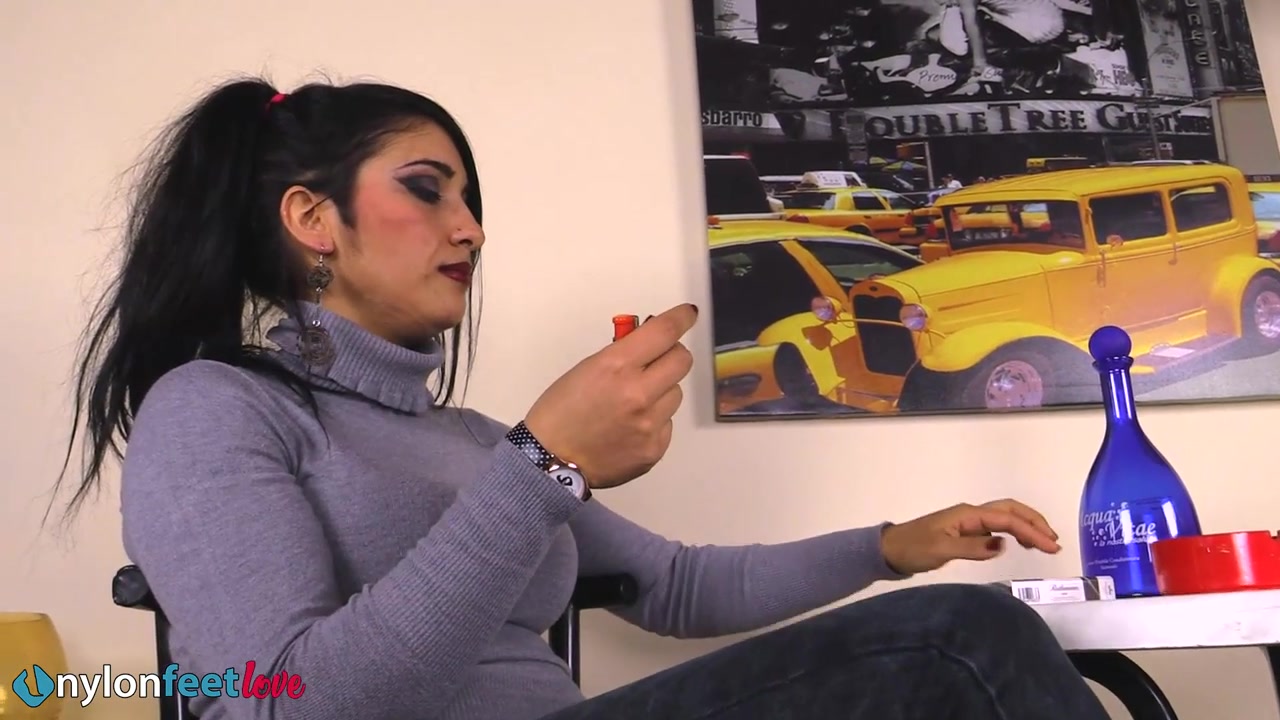 Gorgeous Sharon smoking a cigarette and showing off her nyloned feet