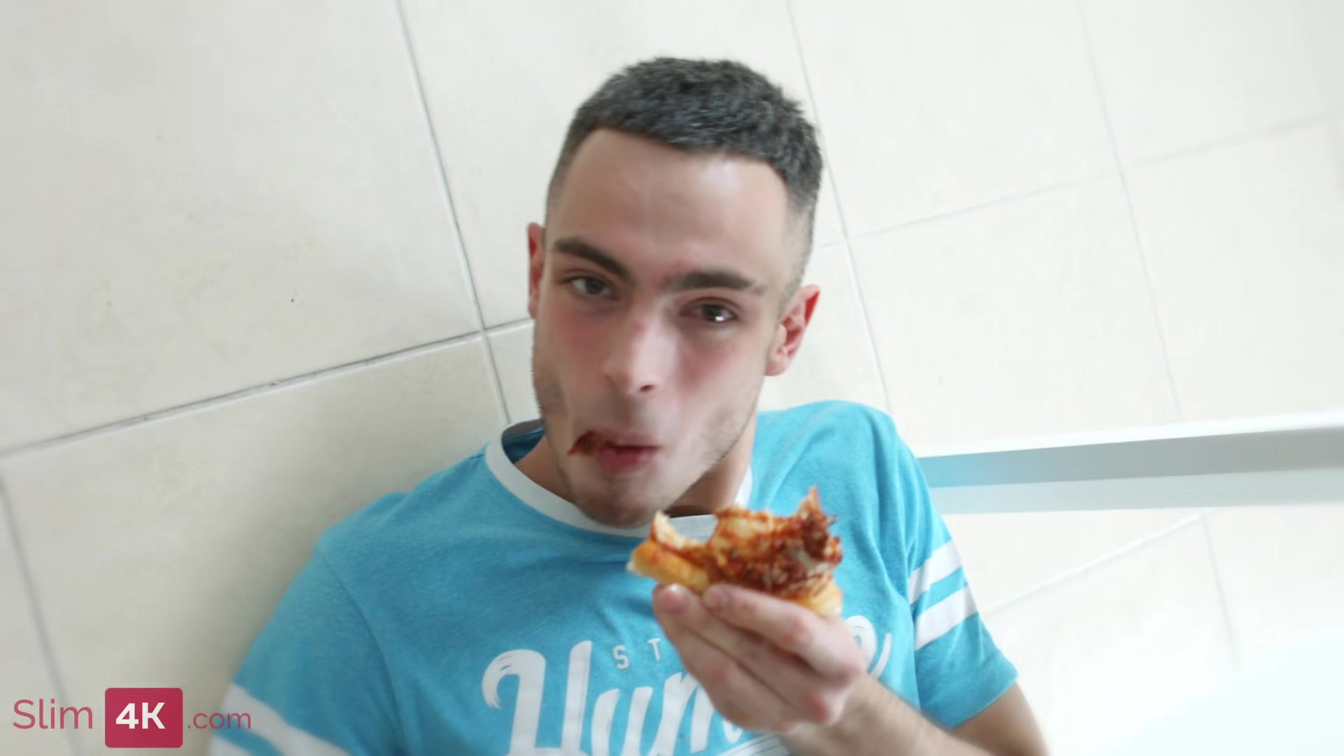 Blond-haired beauty stuffs her face with pizza before getting fucked in the kitchen