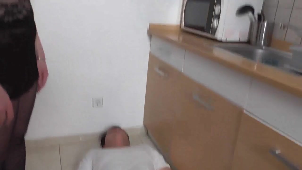 Trampling in the kitchen on her slave husband by Femdom Austria