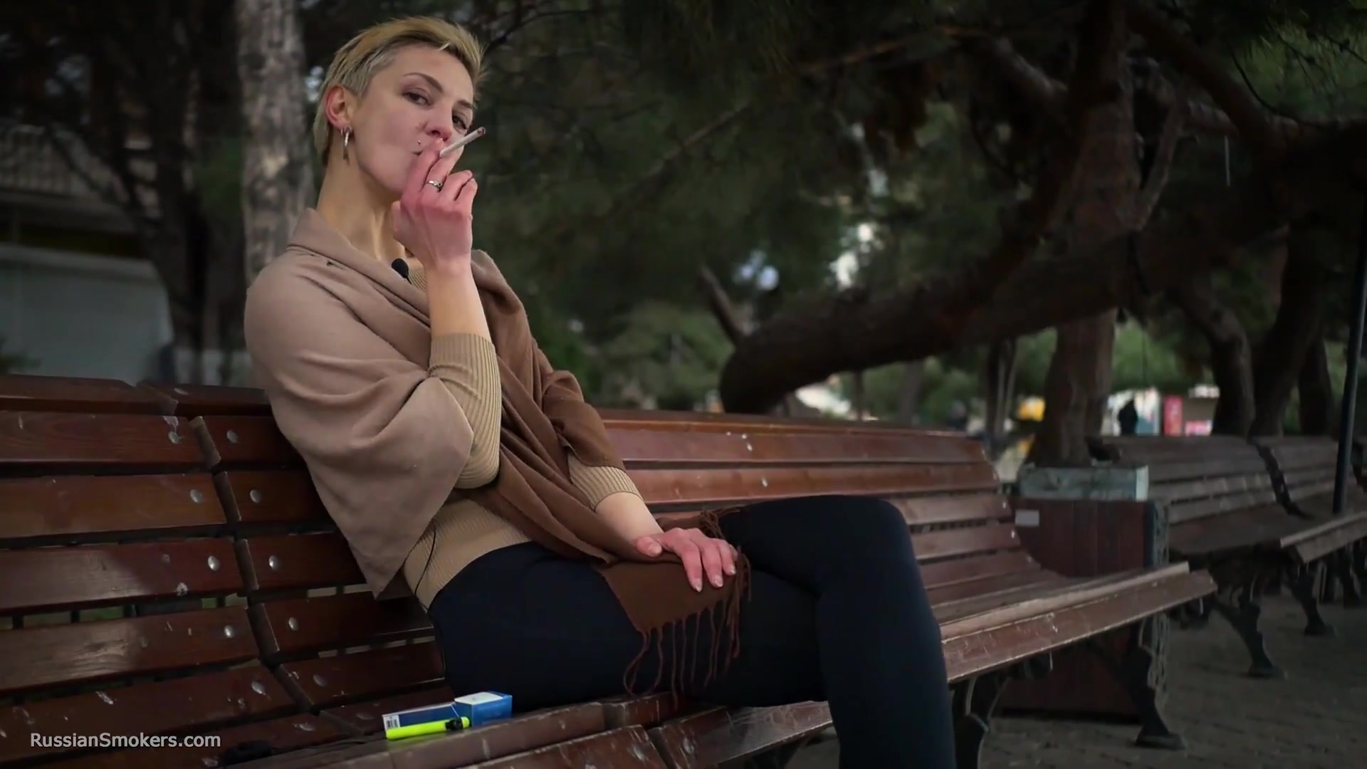 Short Cut Hair Blonde Girl Is Smoking All White 120mm Cigarettes