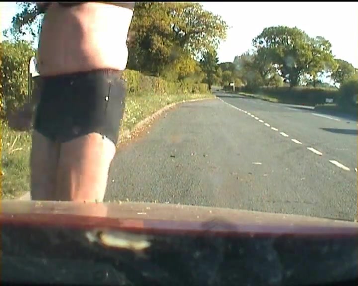 Amateur crossdresser in lingerie on a road