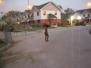 Curly black slut walks naked around the neighborhood