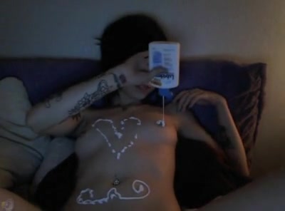 Tattooed emo babe playing with her boobies and pussy