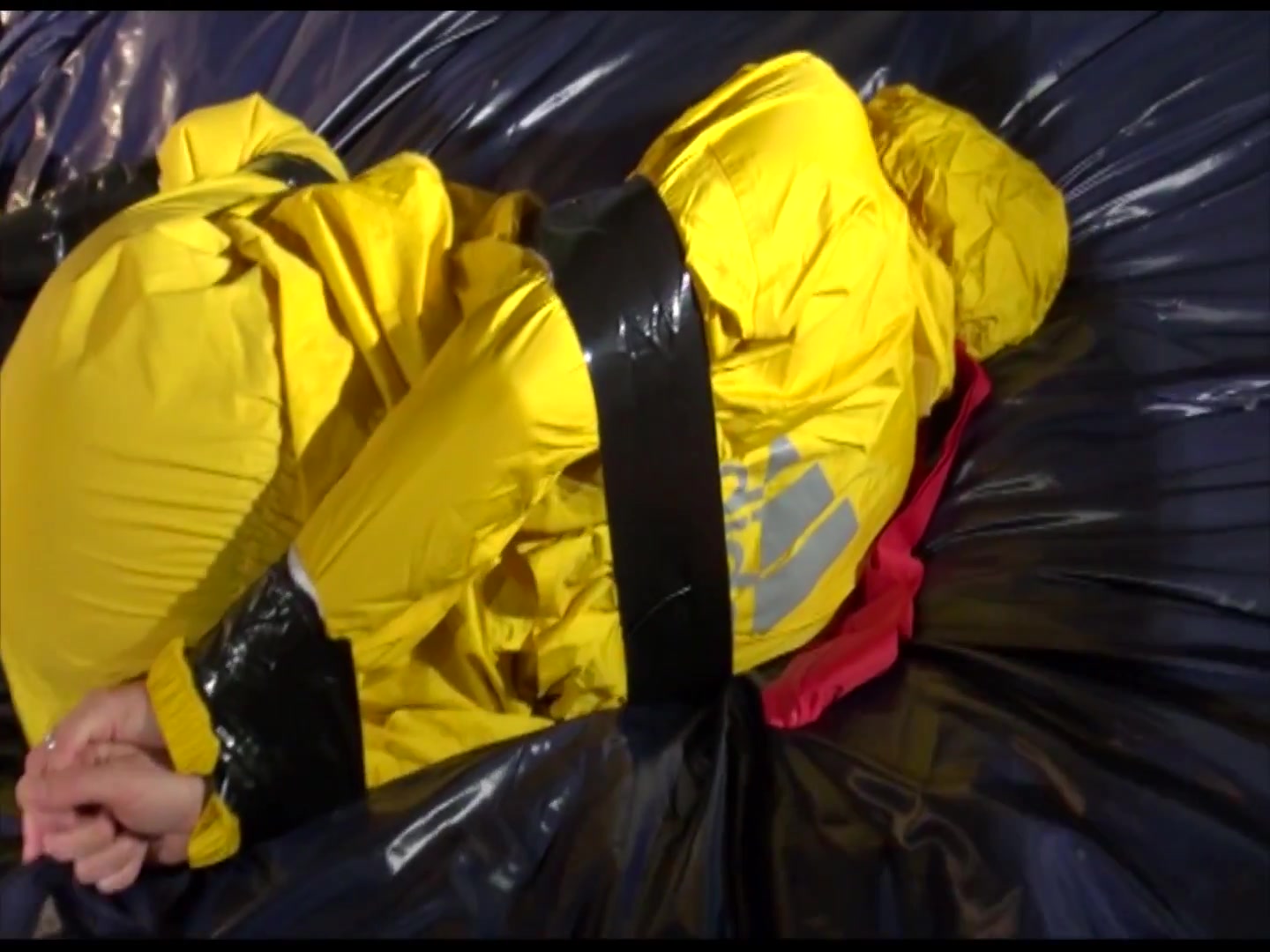 Get 2 Archivevideos With Sonja Enjoying Bondage In Her Shiny Nylon Rainwear