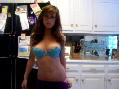 Young busty chick strips in the kitchen, where she belongs