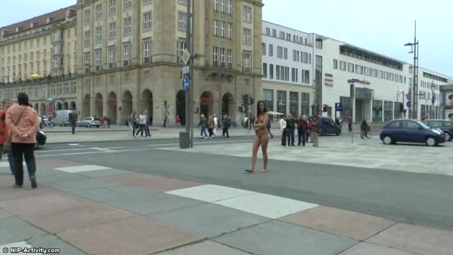 Long haired brunette walks naked in public in hd movie