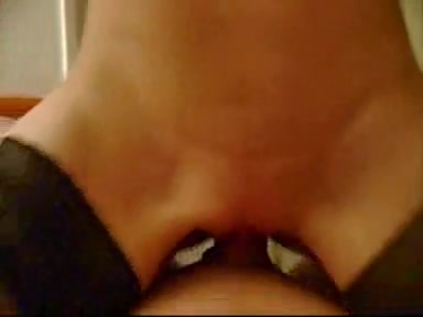 Black-haired wench dressed in her sexy stockings gives pleasure