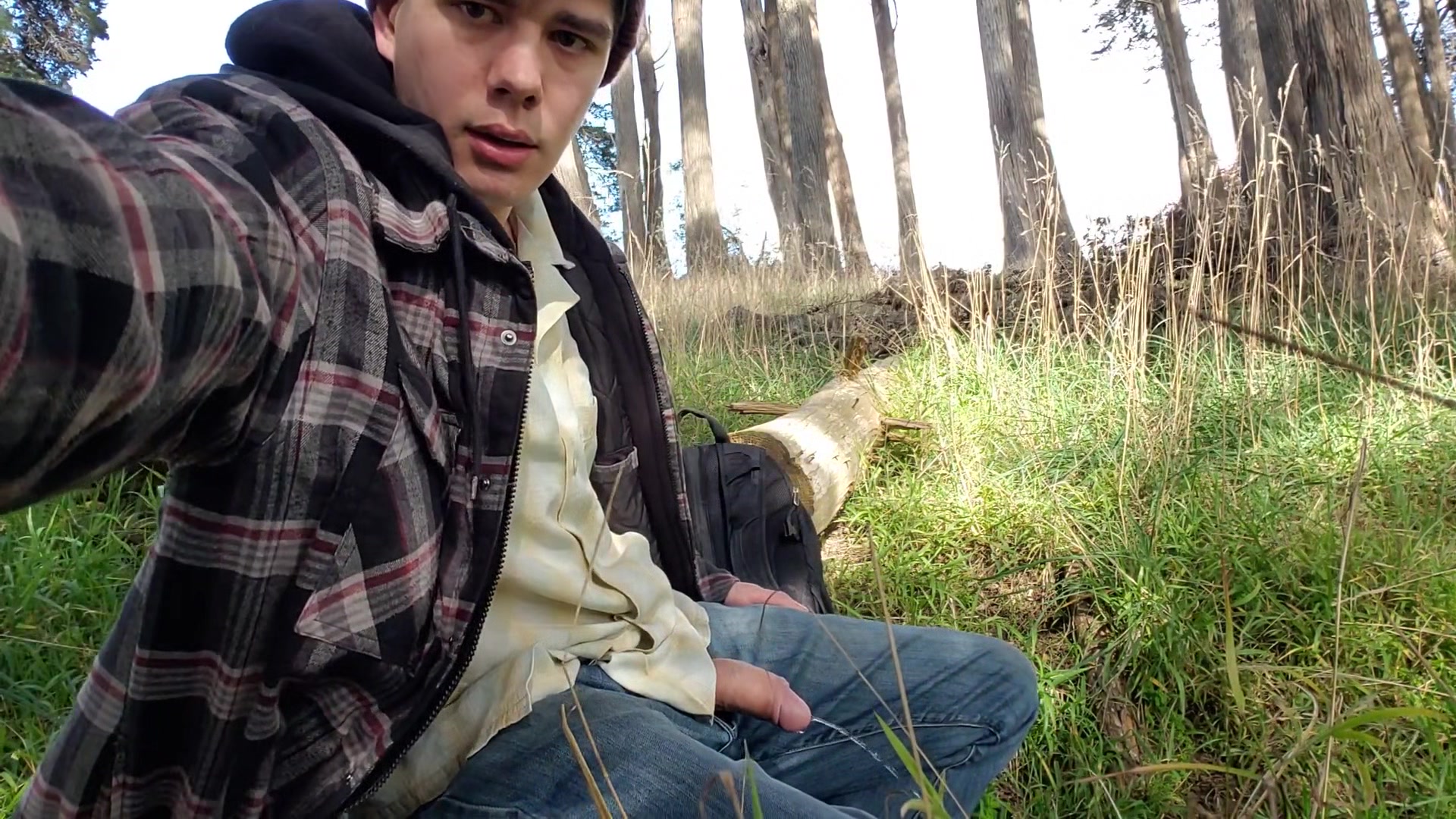 Boy stops jacking off to piss in the woods