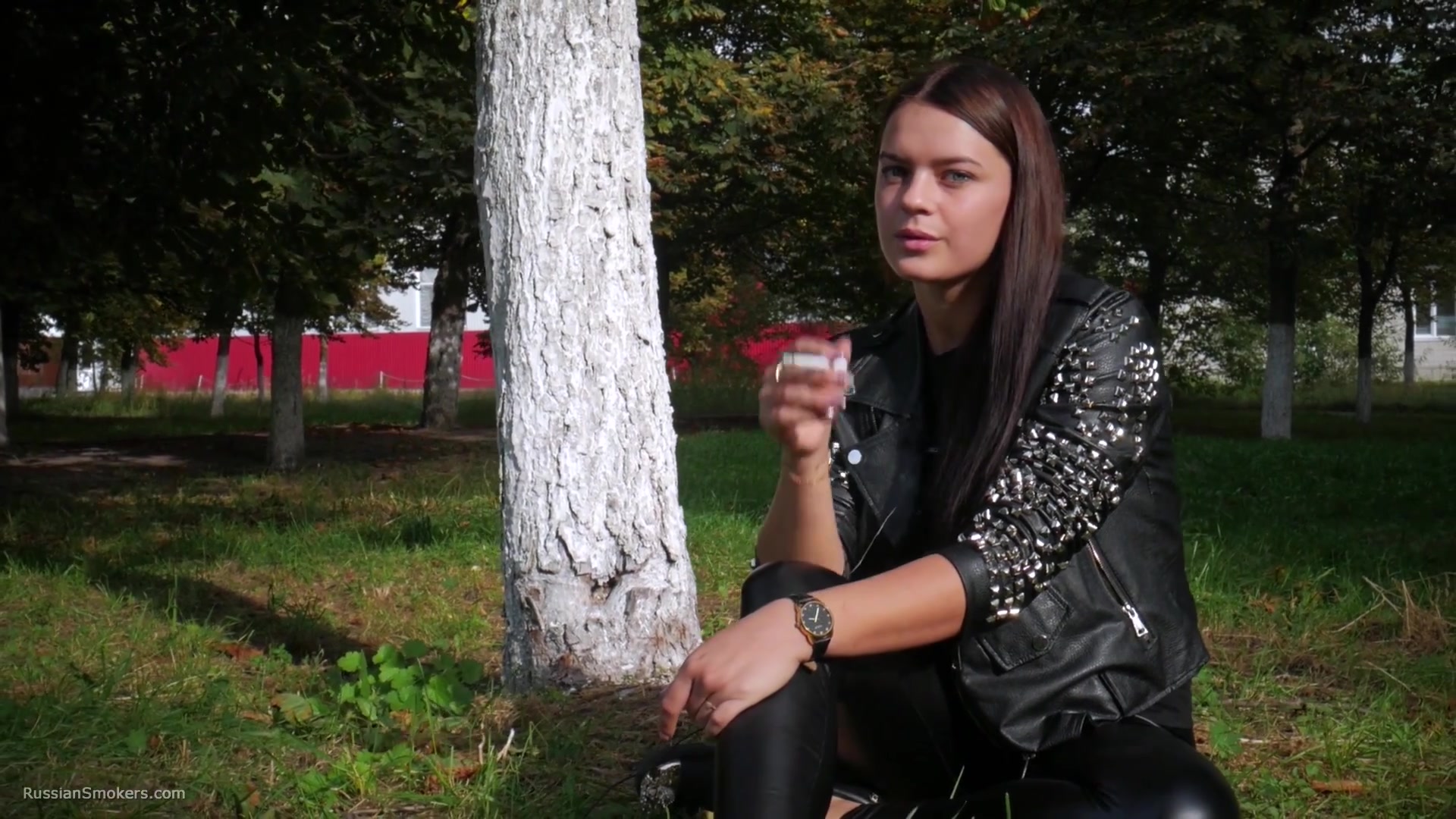 Pretty Faced Asya Is Smoking A Cigarette Outdoors