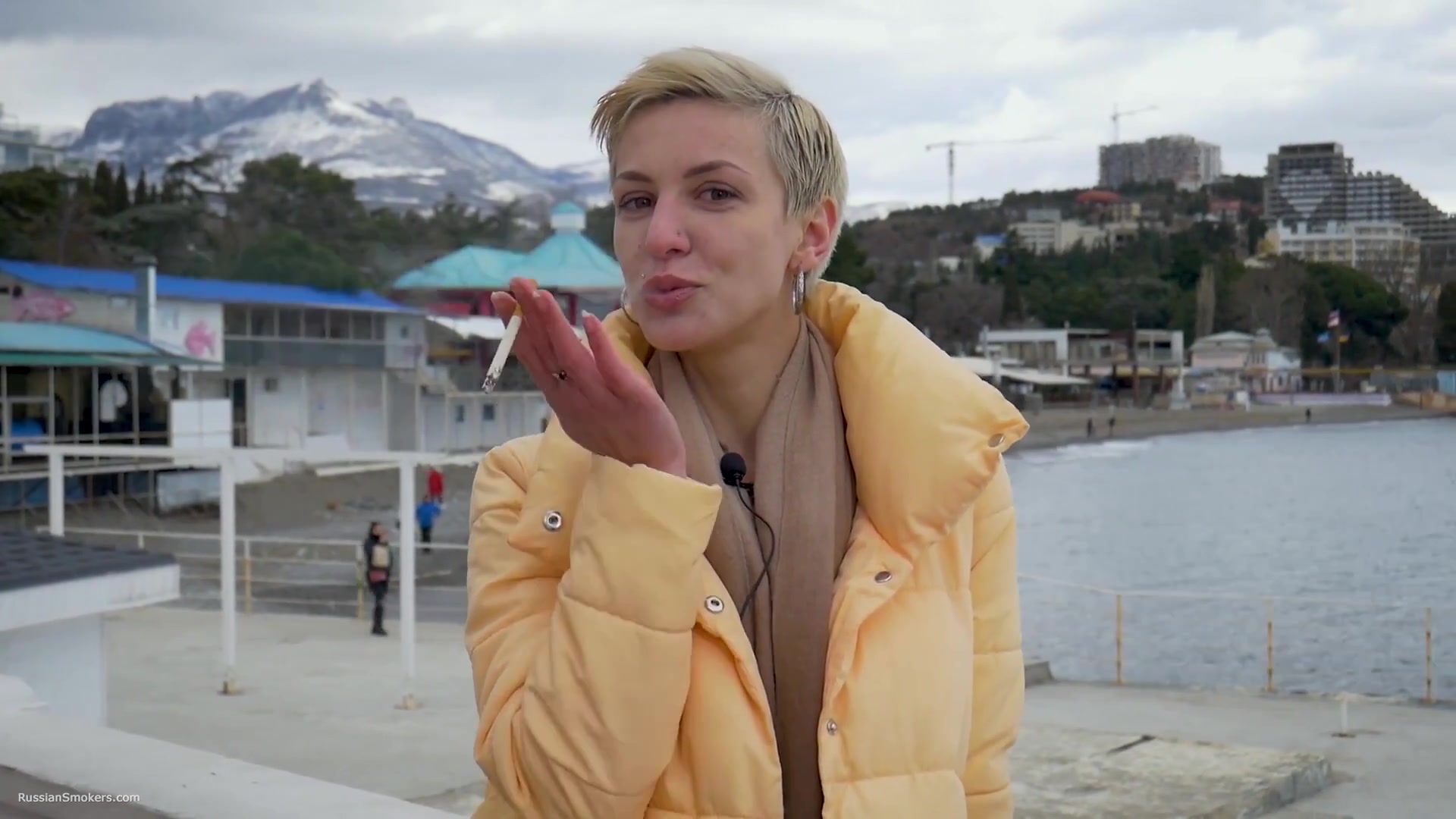 Short Cut Hair Blonde Girl Is Smoking Two Cork Cigarettes