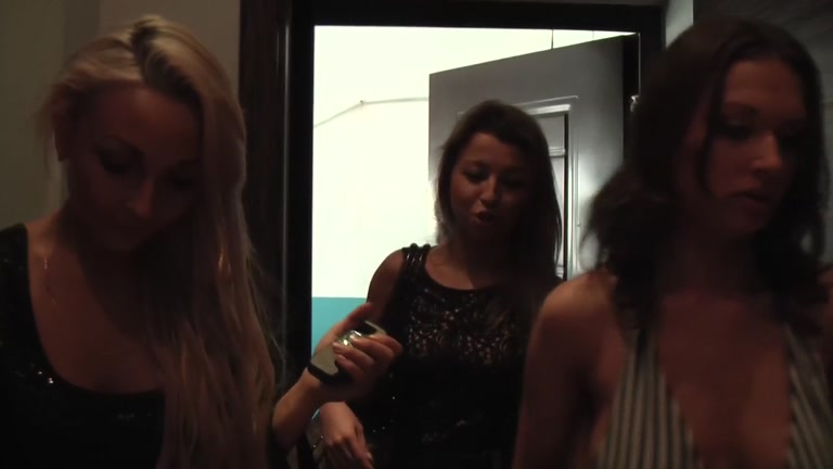 Lesbians prepare dildos for sex session