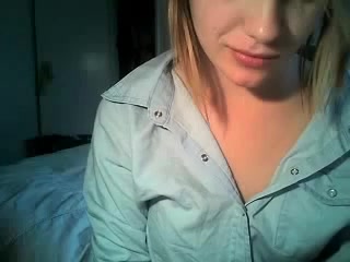 Young blonde bitch undresses with passion on webcam