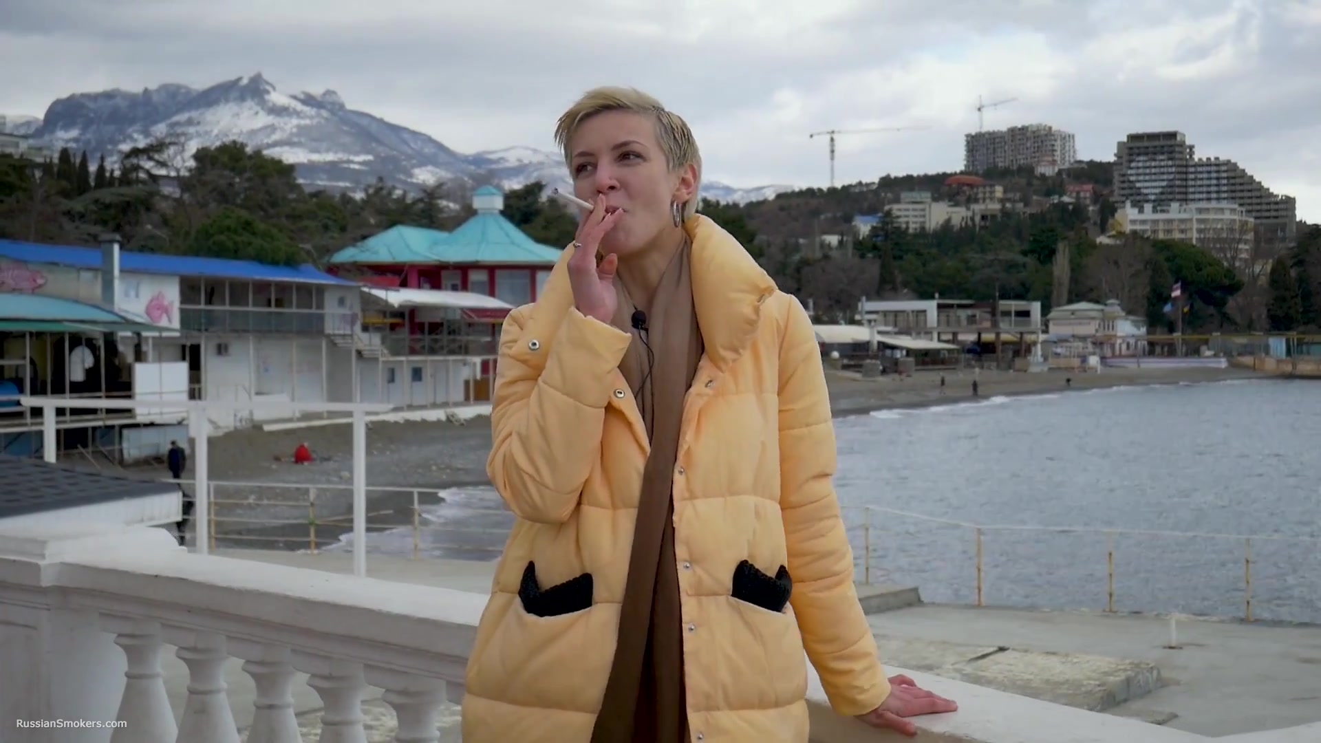 Short Cut Hair Blonde Girl Is Smoking Two Cork Cigarettes