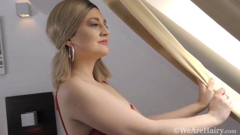Teresa Suarez slides off her sexy red dress in bed