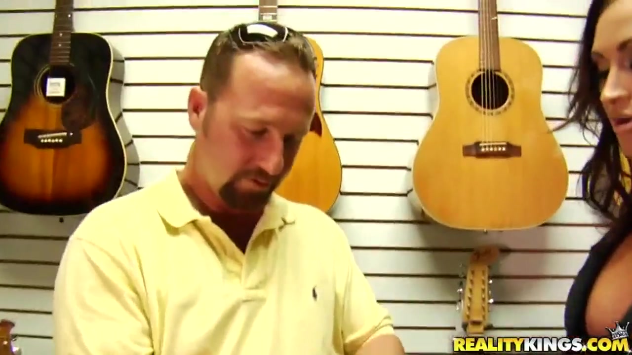 Dark haired chick is fucked in a musical shop