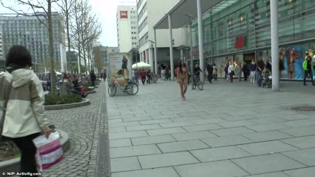Long haired brunette walks naked in public in hd movie