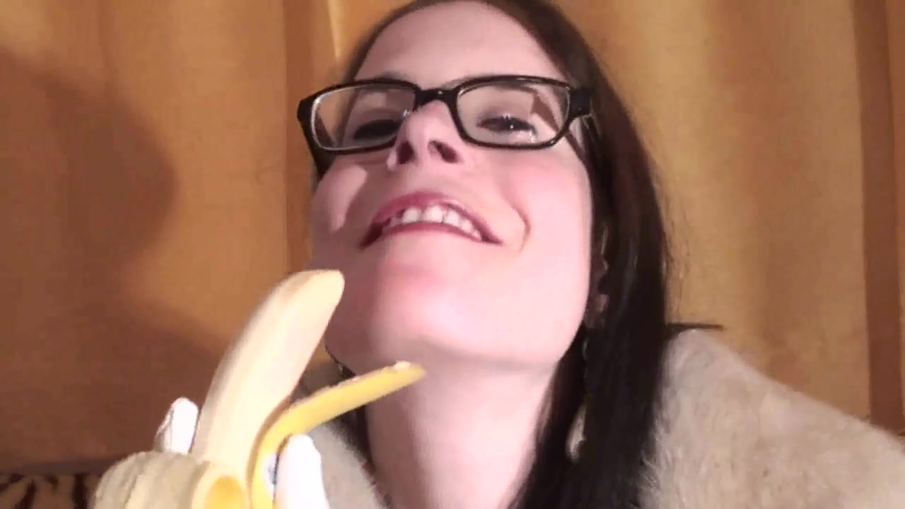Spex brunette talking dirty while eating banana by Femdom Austria