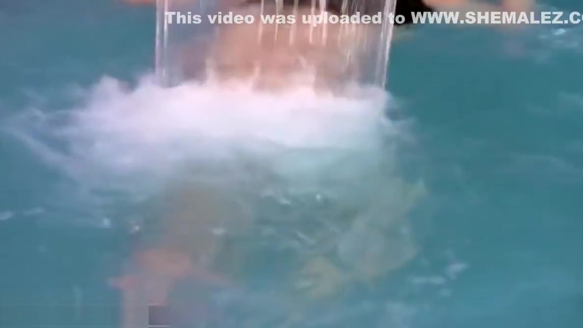 Big ass tranny plays with her massive penis in pool and cums