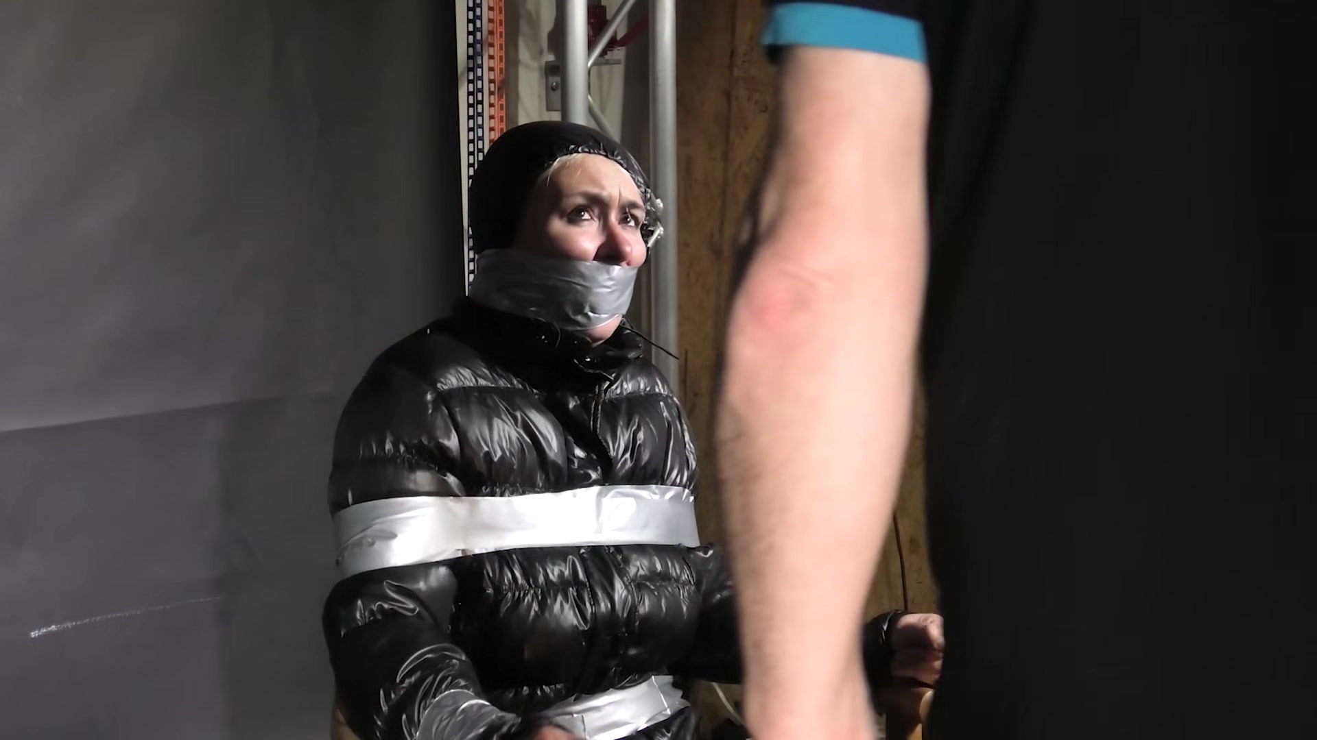 Alice Taped To A Chair And Tapegagged In Shiny Nylon Downjacket