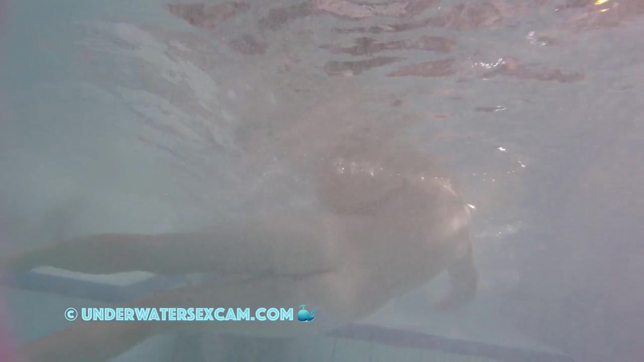 This Young Couple Plays Together Underwater In Front Of Many People