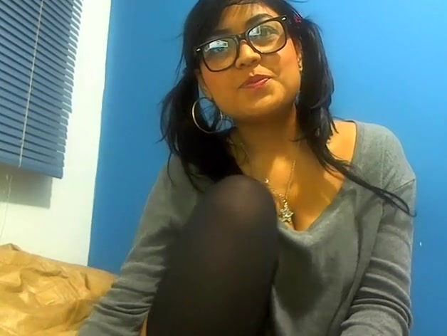 Pig-tailed adorable gal sucking a lollipop and showing her cleavage