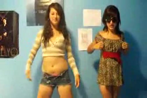 Stunning young brunettes dancing to music and stripping