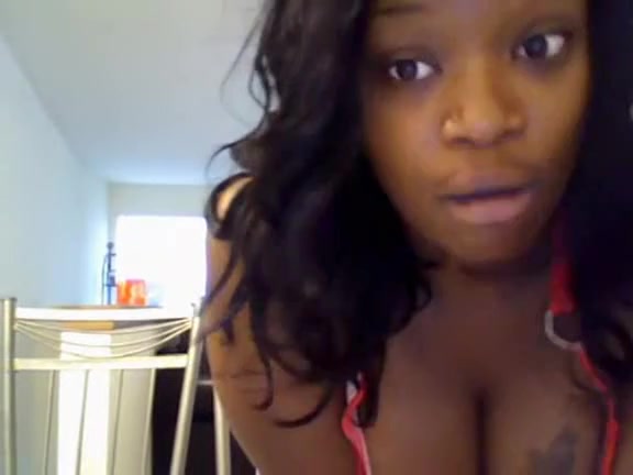 Black chick perform a seducing dance in front of a webcam