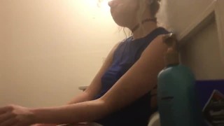 sexy skinny blonde smokes in front of boyfriend