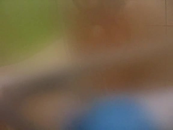 Young Asian babe caught naked in the bathroom by horny
